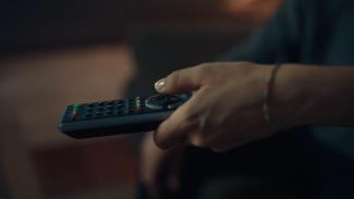 remote for tv in hand